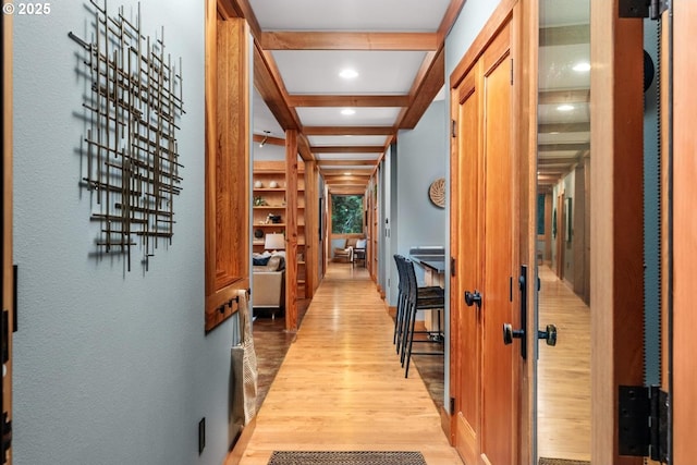 corridor featuring light wood-type flooring, beam ceiling, and recessed lighting