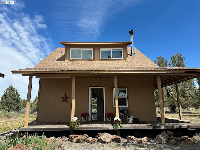9949 Geneva View Rd, Terrebonne, OR 97760 - back of house featuring roof with shingles and a porch