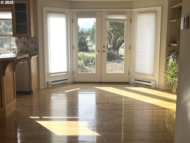 9949 Geneva View Rd, Terrebonne, OR 97760 - entryway featuring a baseboard heating unit, french doors, and wood-type flooring