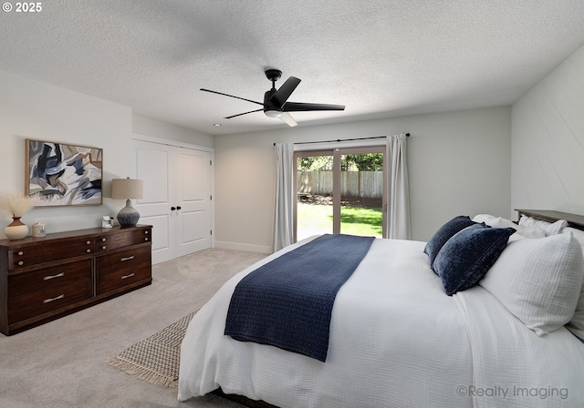 10262 SE 99th Dr, Happy Valley, OR 97086 - bedroom with light colored carpet, a ceiling fan, a textured ceiling, and access to exterior