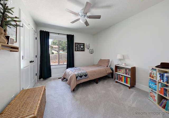 10262 SE 99th Dr, Happy Valley, OR 97086 - carpeted bedroom featuring baseboards, ceiling fan, and a textured ceiling