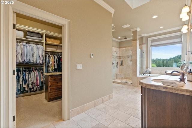 4640 SE Honors Dr, Gresham, OR 97080 - full bathroom with ornamental molding, baseboards, a sink, tiled shower, and a walk in closet
