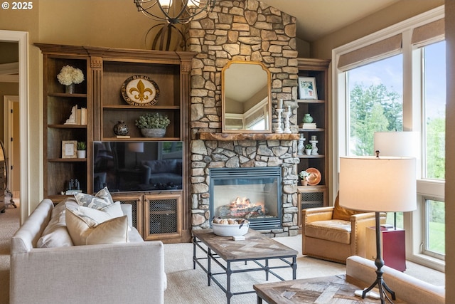 4640 SE Honors Dr, Gresham, OR 97080 - living area featuring a stone fireplace, a chandelier, vaulted ceiling, and built in shelves