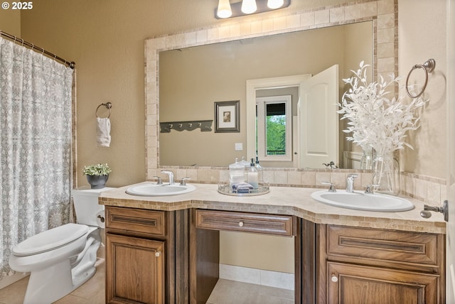 4640 SE Honors Dr, Gresham, OR 97080 - bathroom featuring double vanity, toilet, tile patterned floors, and a textured wall