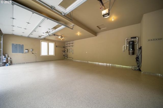 4640 SE Honors Dr, Gresham, OR 97080 - garage featuring a garage door opener, a central vacuum unit, and electric panel
