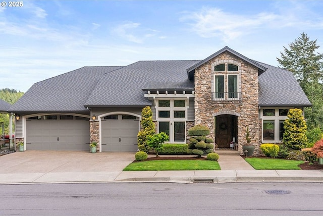 4640 SE Honors Dr, Gresham, OR 97080 - view of front of property with stone siding, an attached garage, and driveway