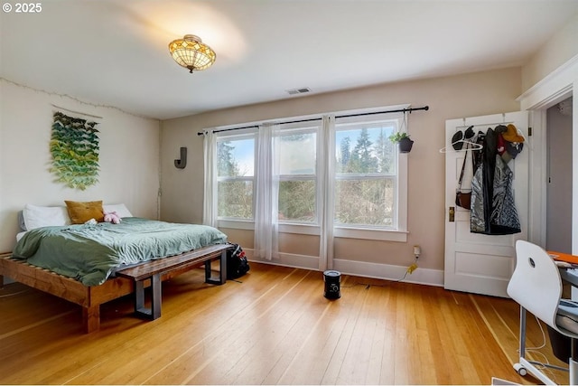 bedroom with light hardwood / wood-style floors