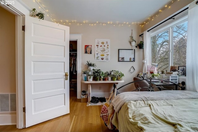 bedroom with light wood-type flooring