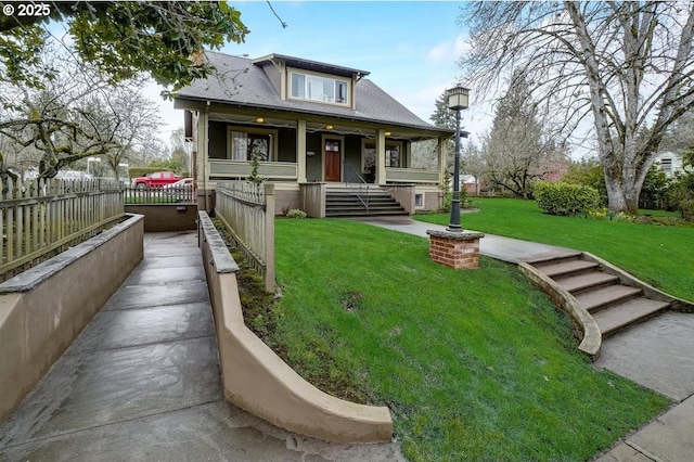 bungalow-style home with a porch and a front yard