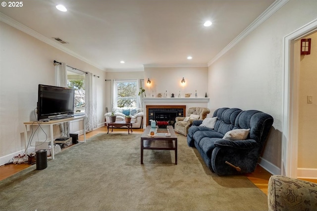 living room with ornamental molding and light wood-type flooring