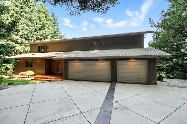 38617 SE Nichols Hill Rd, Washougal, WA 98671 - view of front facade with concrete driveway and a garage