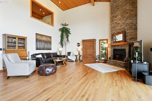 38617 SE Nichols Hill Rd, Washougal, WA 98671 - living area featuring high vaulted ceiling, wood finished floors, a wooden ceiling with exposed beams, and a fireplace