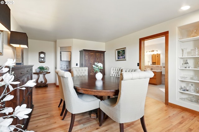 38617 SE Nichols Hill Rd, Washougal, WA 98671 - dining area with light wood-style floors and built in shelves