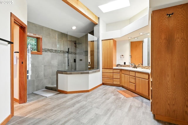 38617 SE Nichols Hill Rd, Washougal, WA 98671 - full bathroom with a walk in shower, vanity, wood finished floors, a skylight, and recessed lighting