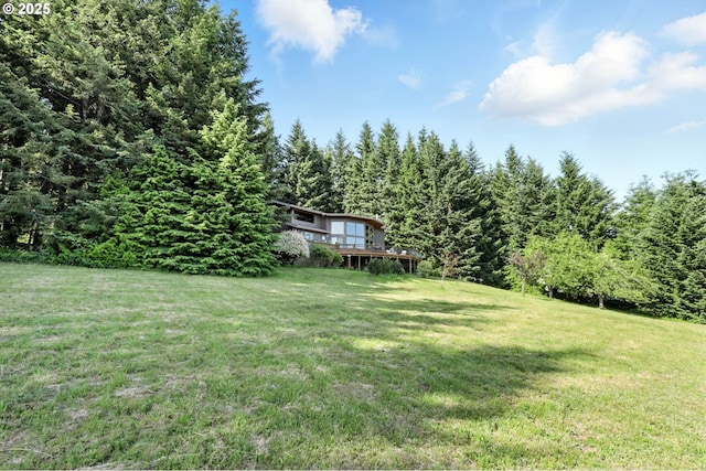 38617 SE Nichols Hill Rd, Washougal, WA 98671 - view of grassy yard with a wooden deck and a wooded view