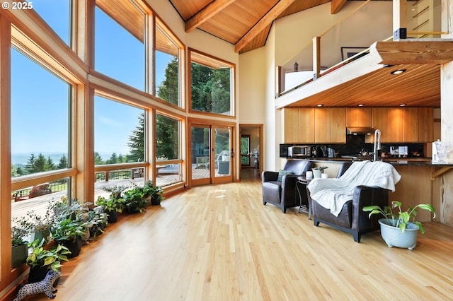 38617 SE Nichols Hill Rd, Washougal, WA 98671 - living area featuring high vaulted ceiling, light wood-style flooring, healthy amount of natural light, and a wood ceiling with exposed beams