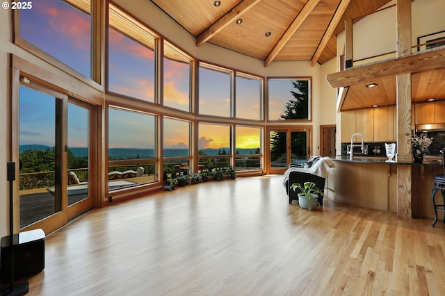 38617 SE Nichols Hill Rd, Washougal, WA 98671 - living room with high vaulted ceiling, a wood ceiling with exposed beams, and light wood finished floors