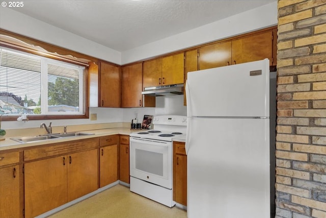 861 Dietz Ave NE, Keizer, OR 97303 - kitchen featuring white appliances, under cabinet range hood, light countertops, and brown cabinets