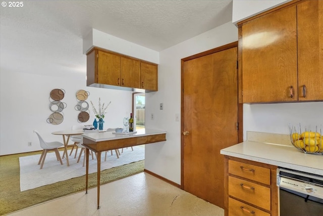 861 Dietz Ave NE, Keizer, OR 97303 - kitchen featuring white dishwasher, brown cabinets, light countertops, and a textured ceiling