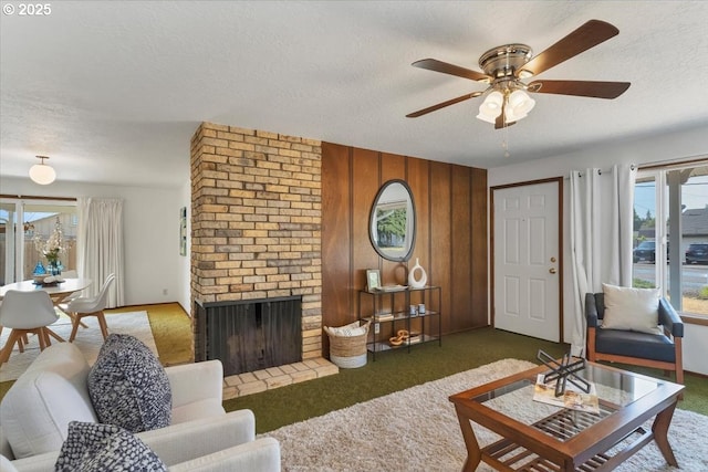 861 Dietz Ave NE, Keizer, OR 97303 - carpeted living room with a textured ceiling, a ceiling fan, a brick fireplace, and wood walls