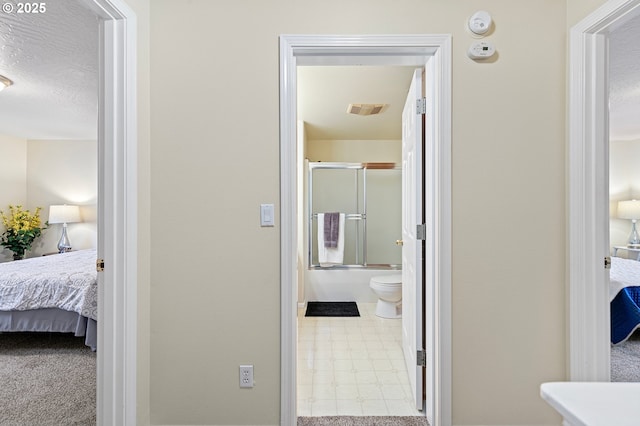 hallway featuring a textured ceiling