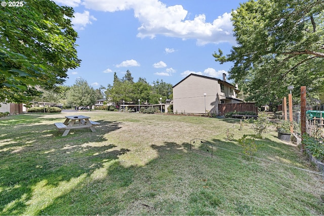 view of yard featuring a wooden deck