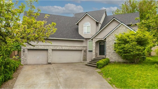 traditional-style home with roof with shingles, concrete driveway, a garage, and a front lawn