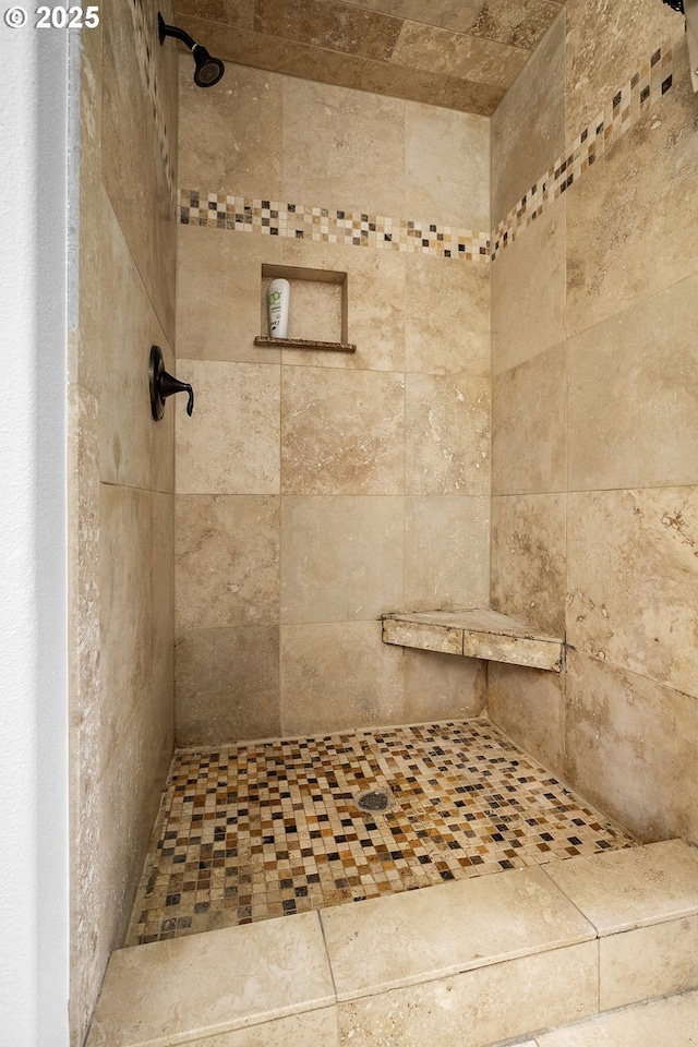bathroom featuring tiled shower