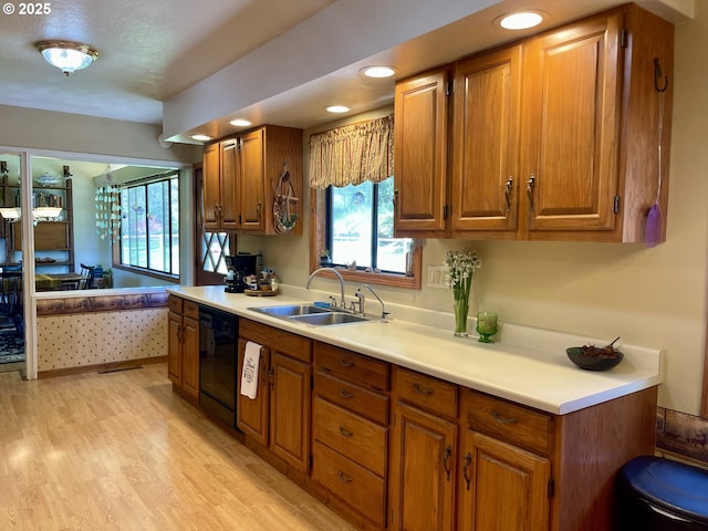54824 Robinson Rd, Coquille, OR 97423 - kitchen featuring a sink, dishwasher, brown cabinets, light wood-style flooring, and recessed lighting