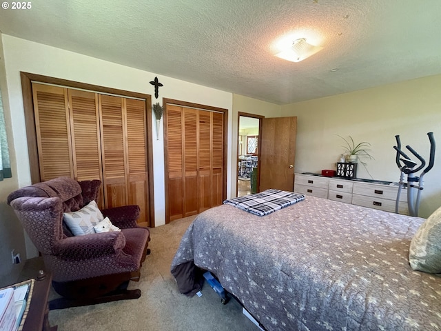 54824 Robinson Rd, Coquille, OR 97423 - carpeted bedroom with multiple closets and a textured ceiling