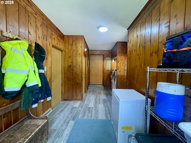 54824 Robinson Rd, Coquille, OR 97423 - laundry area featuring washer / clothes dryer, light wood finished floors, and wooden walls
