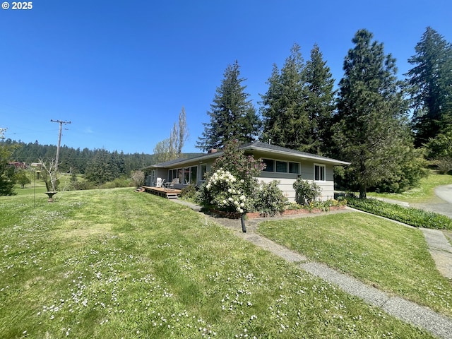 54824 Robinson Rd, Coquille, OR 97423 - view of home's exterior featuring a yard and a deck