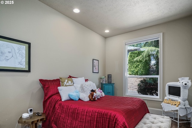 7947 Lavender Ln, Turner, OR 97392 - bedroom featuring baseboards, wood finished floors, a textured ceiling, and recessed lighting