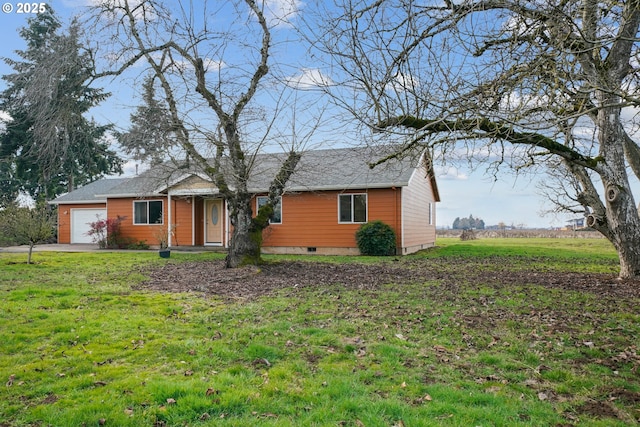 ranch-style home featuring a garage and a front lawn