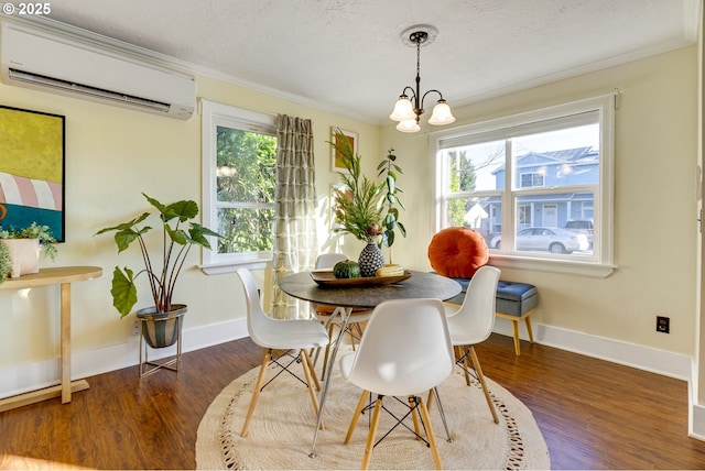 dining space featuring a wall mounted air conditioner, a chandelier, crown molding, dark wood-type flooring, and a textured ceiling