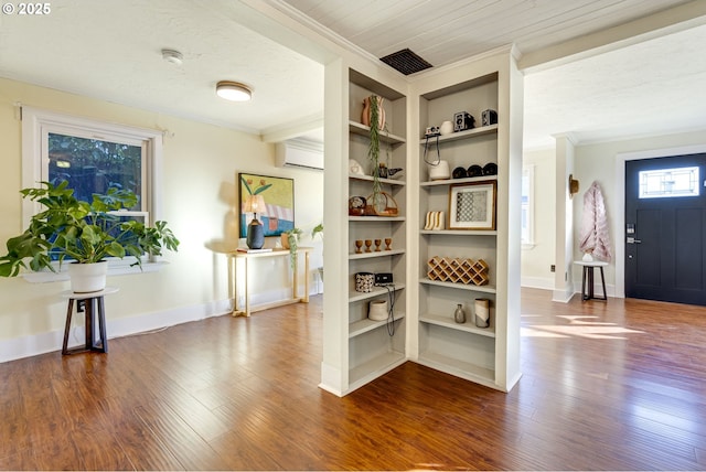 pantry with a wall mounted air conditioner