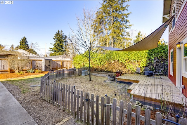 view of yard with a wooden deck