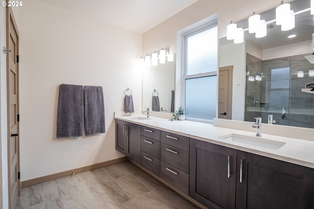 bathroom with vanity and a shower with shower door