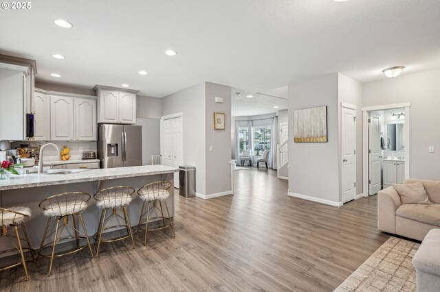 12711 NE 49th Way, Vancouver, WA 98682 - dining space with a chandelier, baseboards, and wood finished floors
