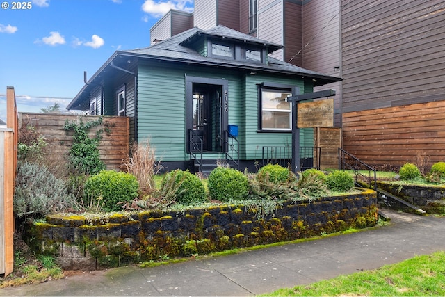 view of exterior entry with fence