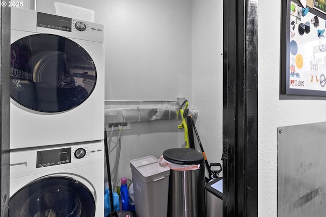 washroom featuring stacked washer and dryer