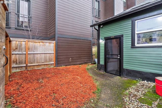 view of home's exterior featuring fence