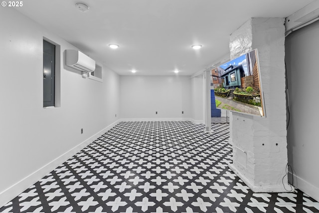 below grade area featuring baseboards, electric panel, recessed lighting, a wall mounted air conditioner, and tile patterned floors