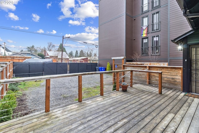 wooden deck featuring a fenced backyard