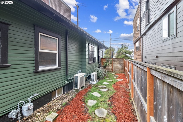 view of property exterior with a fenced backyard