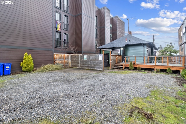 exterior space with a deck and fence