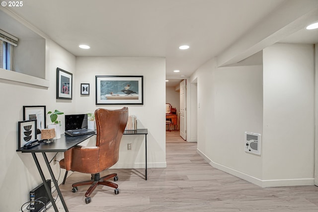 office area featuring recessed lighting, heating unit, light wood-style flooring, and baseboards