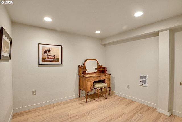office with heating unit, baseboards, recessed lighting, and light wood-style flooring