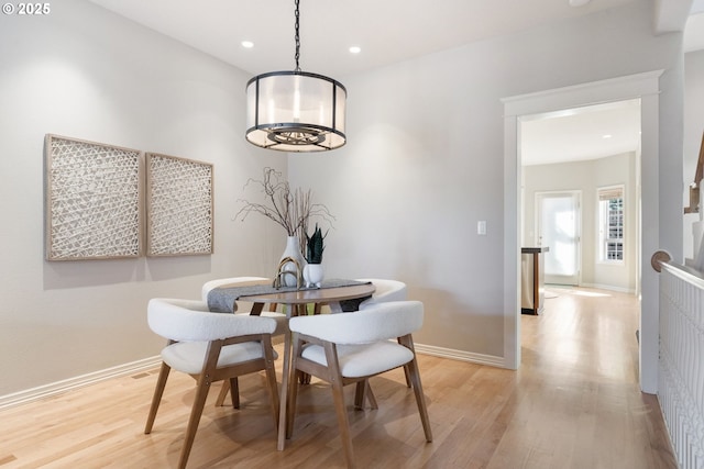 2452 NW Pettygrove St, Portland, OR 97210 - dining space with recessed lighting, light wood-style flooring, and baseboards