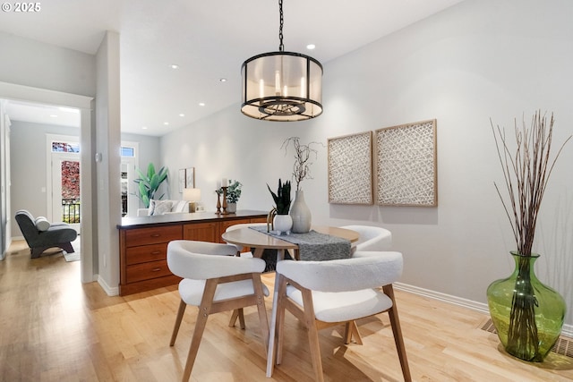 2452 NW Pettygrove St, Portland, OR 97210 - dining room featuring recessed lighting, light wood-style flooring, and baseboards